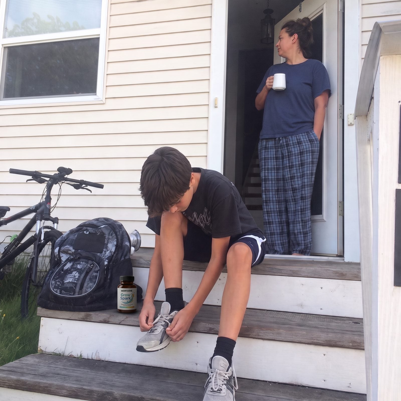 A mom and her son with Grow Spark on their porch